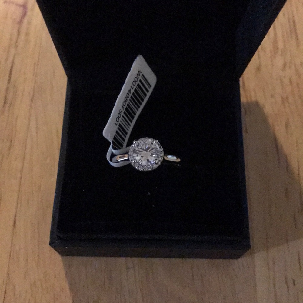 Round cut white sapphire ring